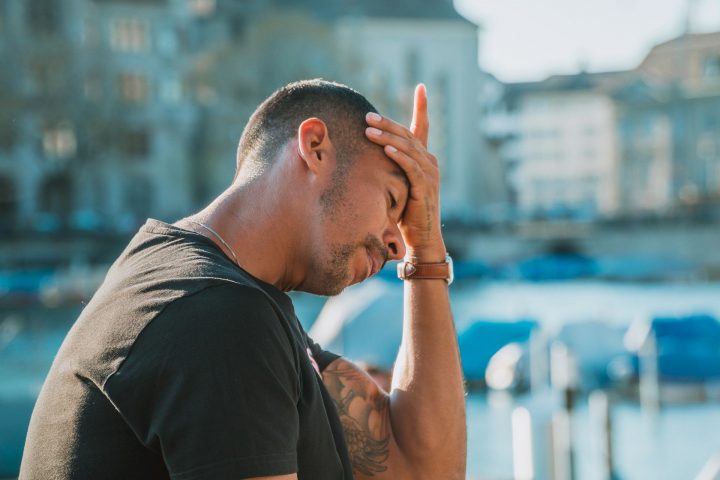 Person overwhelmed by their workload