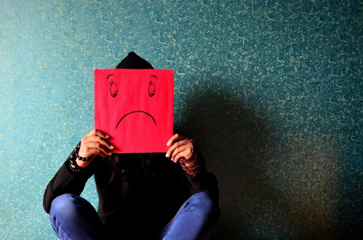 Person feeling low because of pressure at work